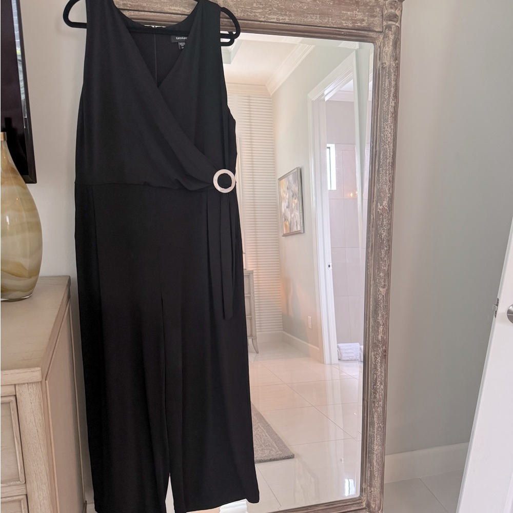 Karen Kane “On Safari” black faux wrap style jumpsuit WITH POCKETS!
Size 18W